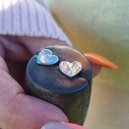 Silver hammered heart earrings.