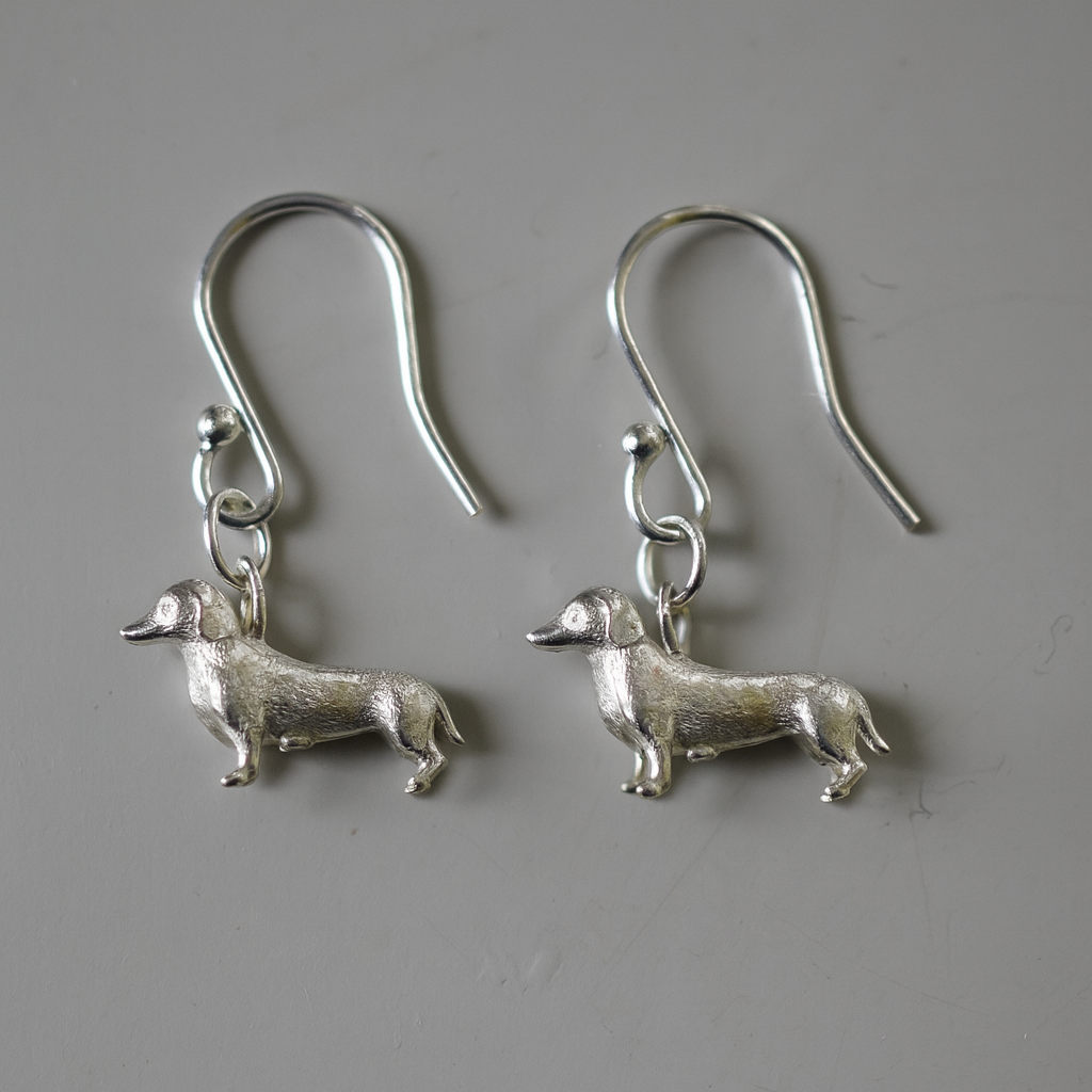 Silver sausage dog earrings