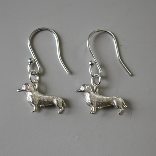 Silver sausage dog earrings