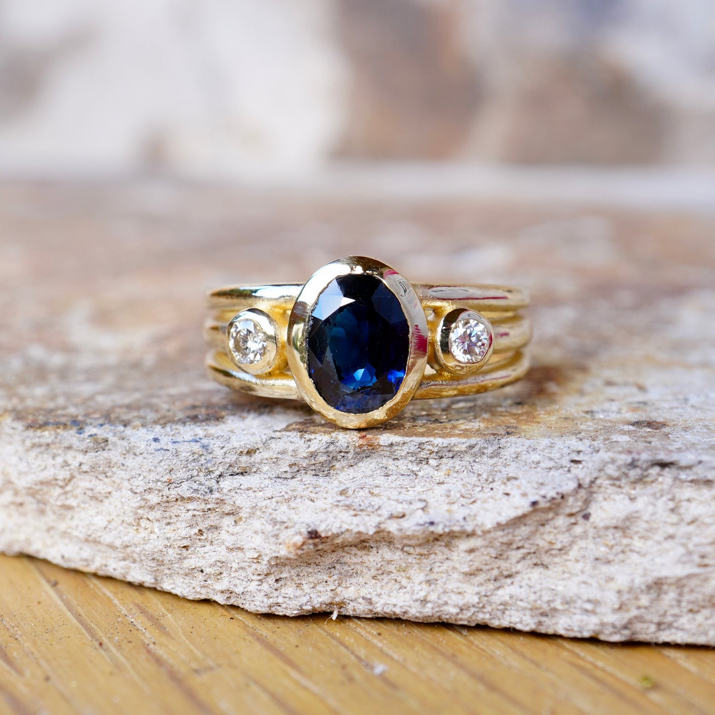 Cariad Lite in gold with large sapphire