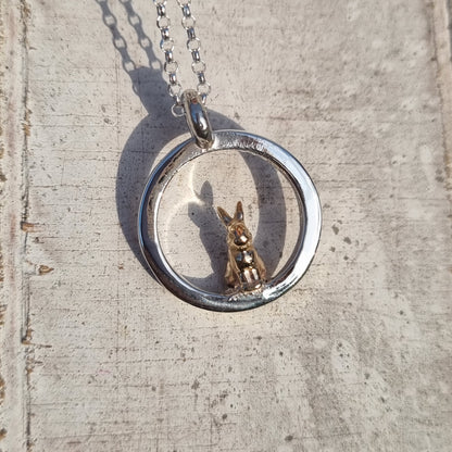 Teeny tiny gold bunny rabbit peeping out of silver halo