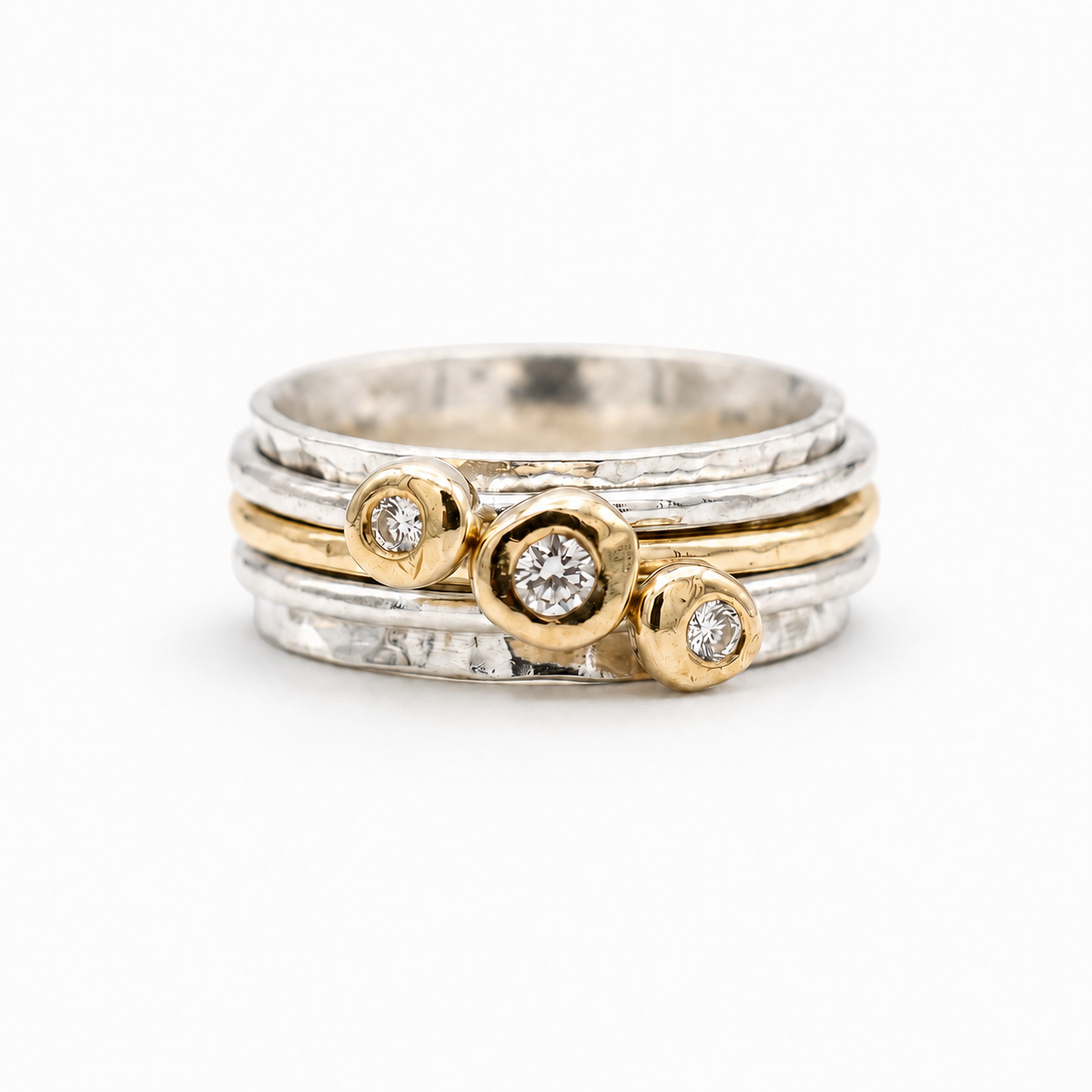 'Cariad' spinning ring handmade with solid gold, silver and diamonds