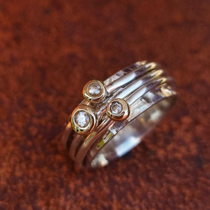 'Cariad' spinning ring handmade with solid gold, silver and diamonds