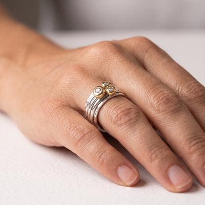 'Cariad' spinning ring handmade with solid gold, silver and diamonds