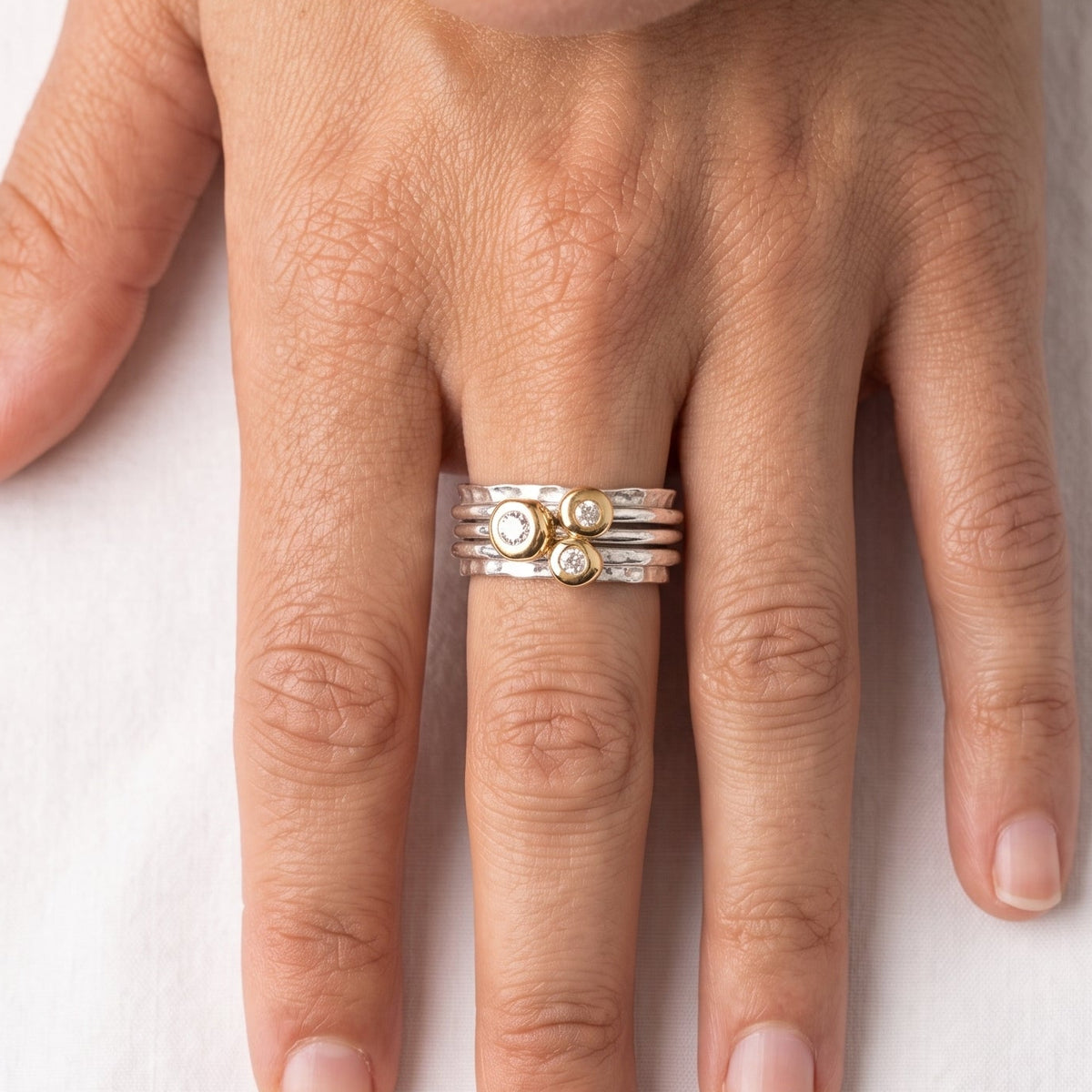 'Cariad' spinning ring handmade with solid gold, silver and diamonds