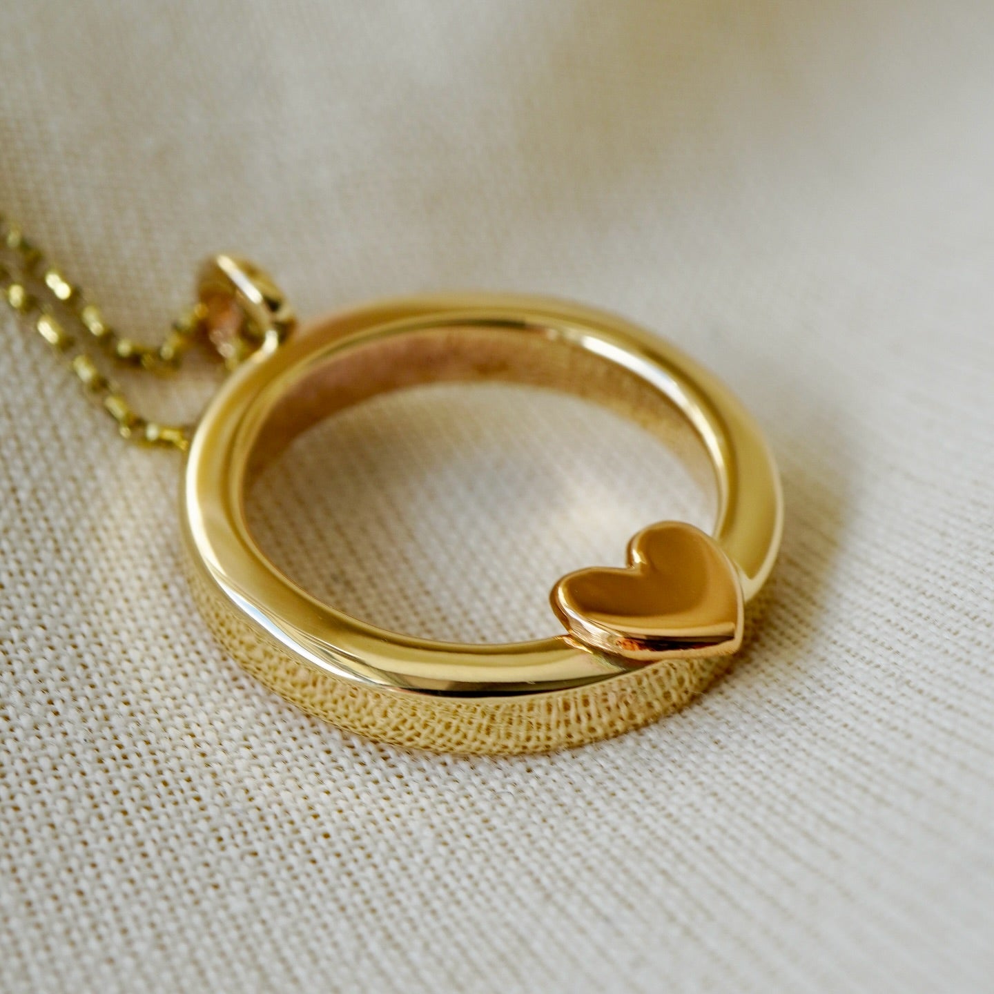 Solid gold ‘One love’ necklace with gold heart and diamond