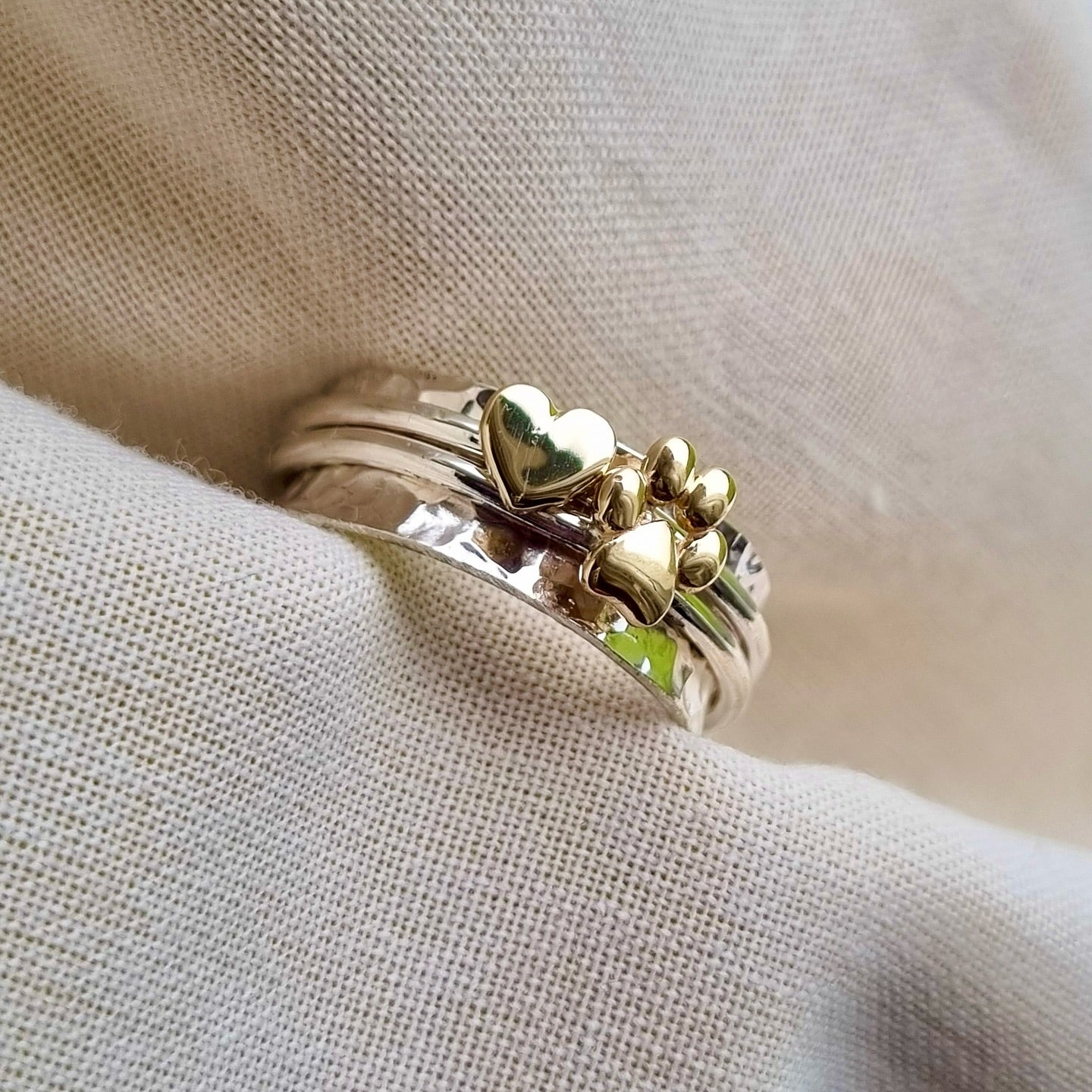 Paw spinning ring with solid gold or silver paw