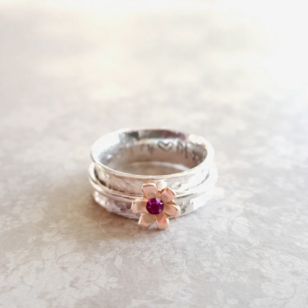 Daisy ring with rose gold detail and ruby