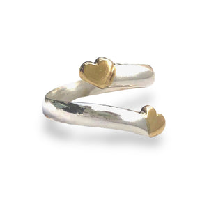 Solid silver twist ring with two gold hearts
