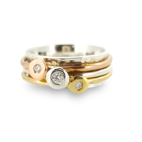 'Scrumdiddlyumptious' - gold rings set with diamonds.