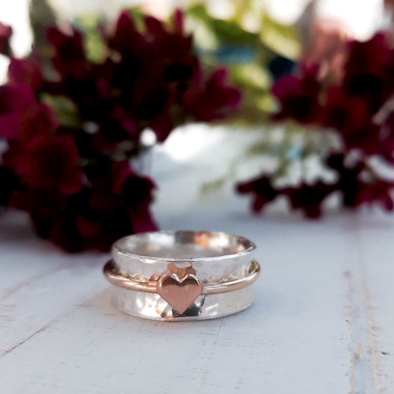 'One Love'. Sterling silver ring with solid gold heart and spinning ring.