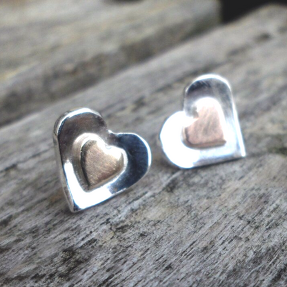 Silver and gold heart earrings.