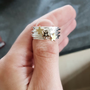 'It's in the stars' - spinning ring with diamonds set in three gold stars
