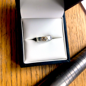 Silver band with 18ct gold open heart. Add a diamond for extra sparkle.
