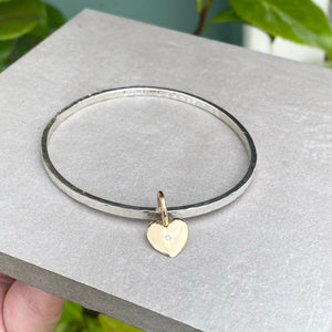 Silver sweetheart bangle with gold heart or star charm