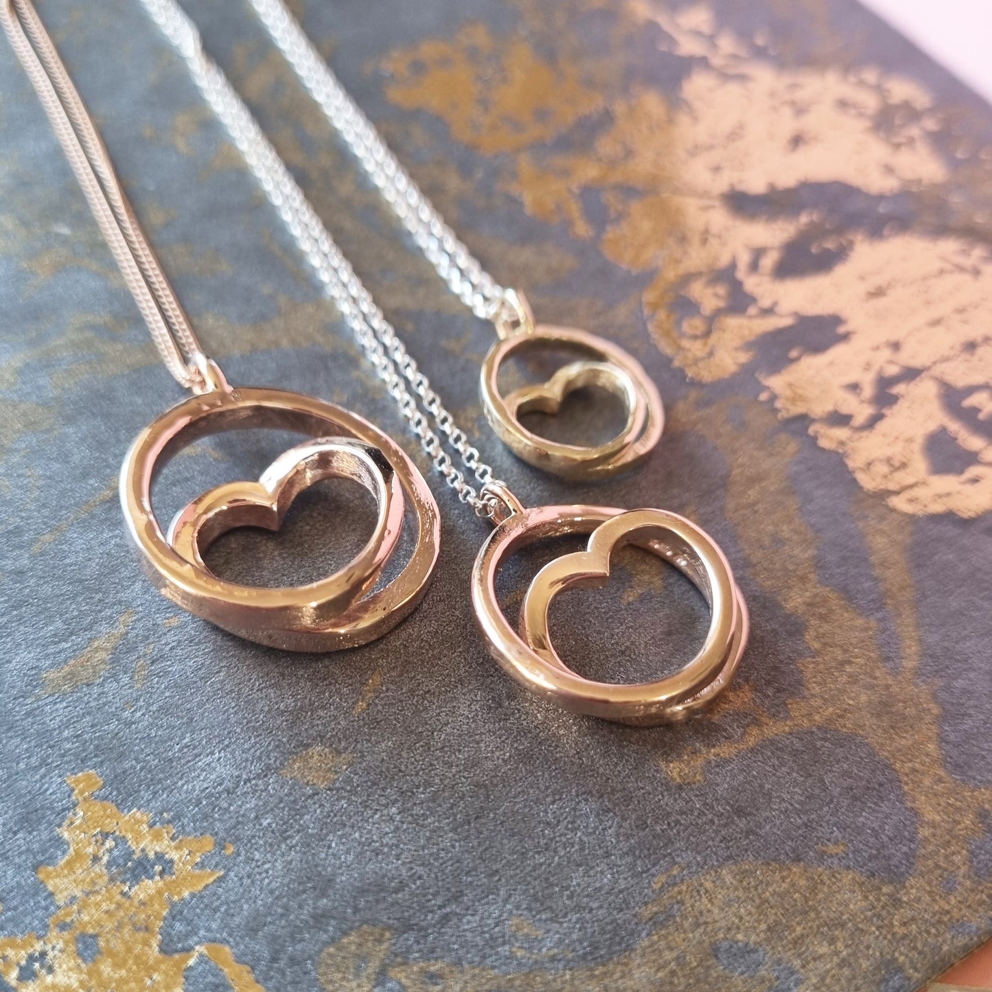 The three sizes of Infinite Love necklace - Classic, mini and tiny