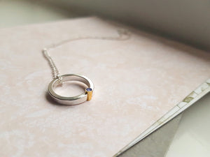 Halo necklace with gemstone set in 9ct gold