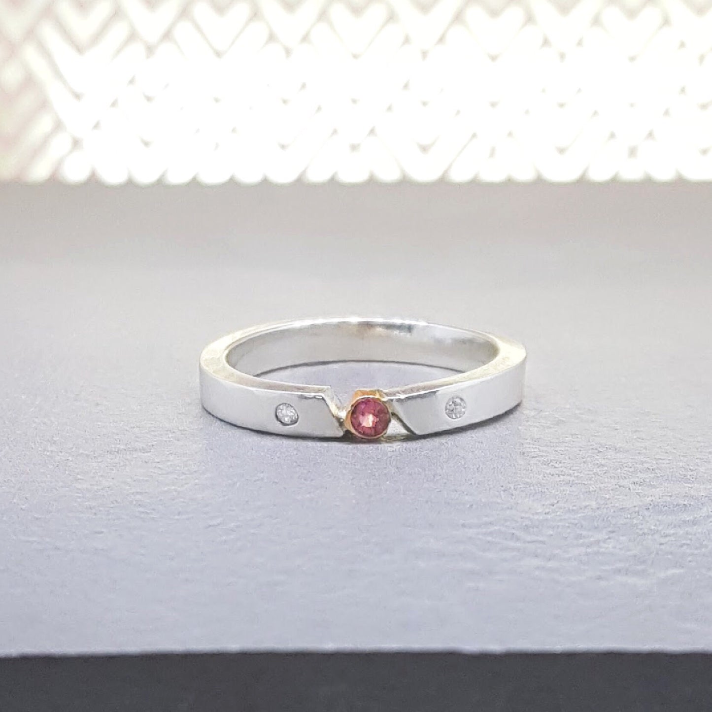 A place in the sun - pink sapphire ring with bezel setting
