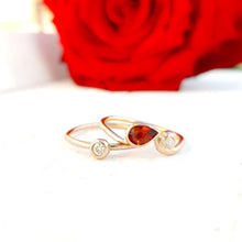 Load image into Gallery viewer, Gold stacking ring set with garnet and diamonds.